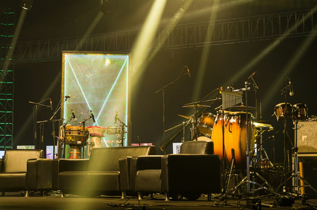 Stage with lights and seating for a live panel event